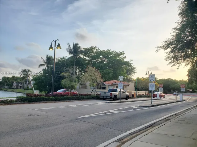 a view of street with parked cars