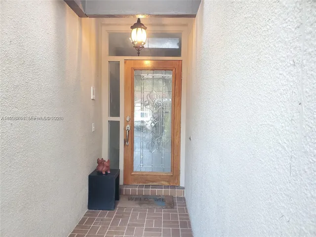 a view of empty room with windows