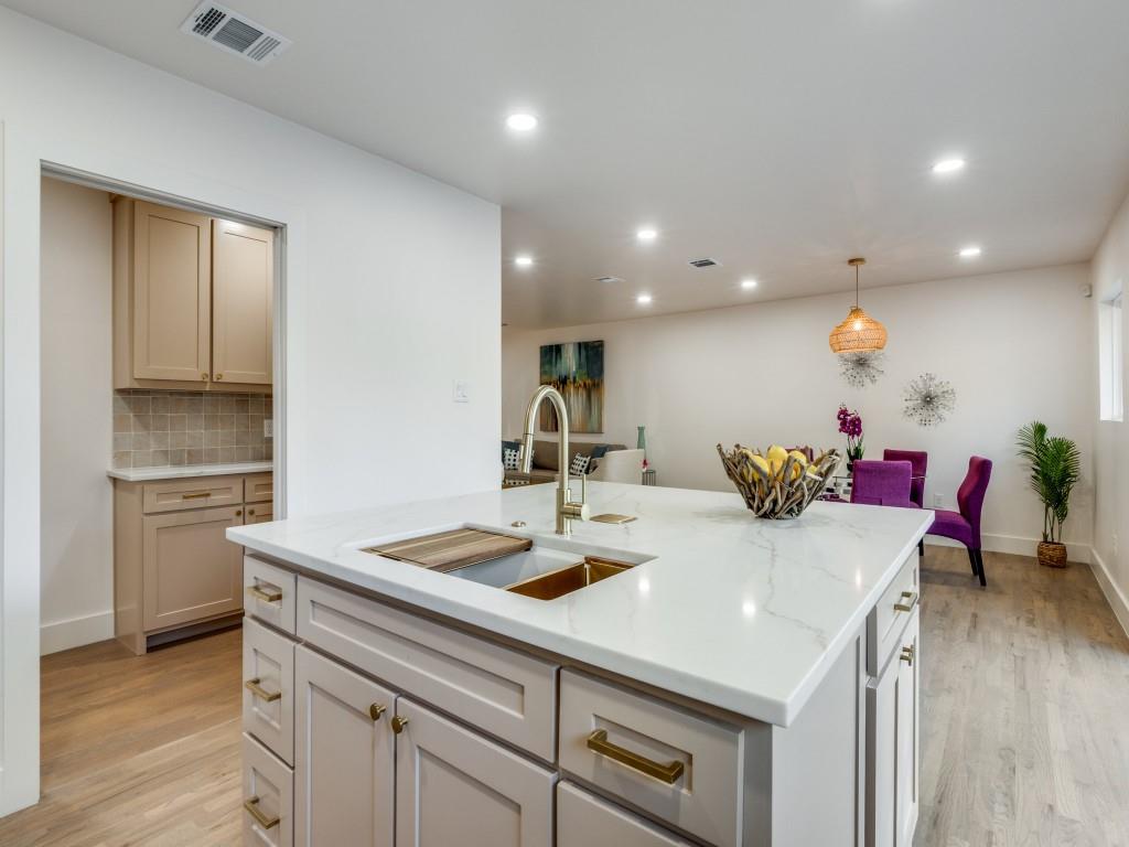 6611 Blessing Drive Dallas, TX 75214 - Photo 12 of 25 a kitchen with a sink cabinets and wooden floor