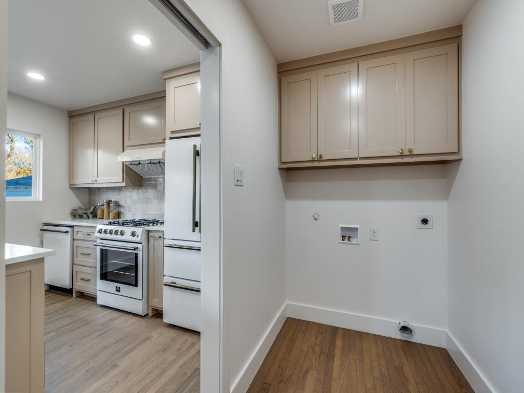 6611 Blessing Drive Dallas, TX 75214 - Photo 13 of 25 a kitchen with a refrigerator and a stove top oven