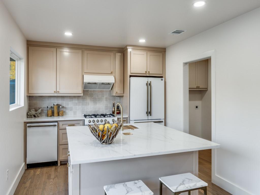 6611 Blessing Drive Dallas, TX 75214 - Photo 15 of 25 a kitchen with refrigerator and cabinets