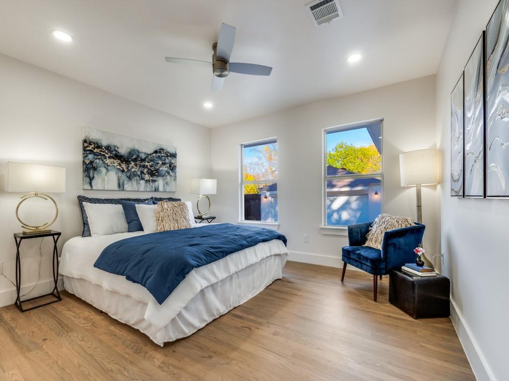 6611 Blessing Drive Dallas, TX 75214 - Photo 17 of 25 a bedroom with a bed and wooden floor