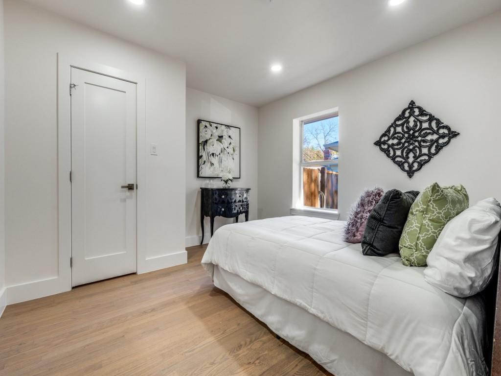 6611 Blessing Drive Dallas, TX 75214 - Photo 21 of 25 a bedroom with a bed and a painting on the wall