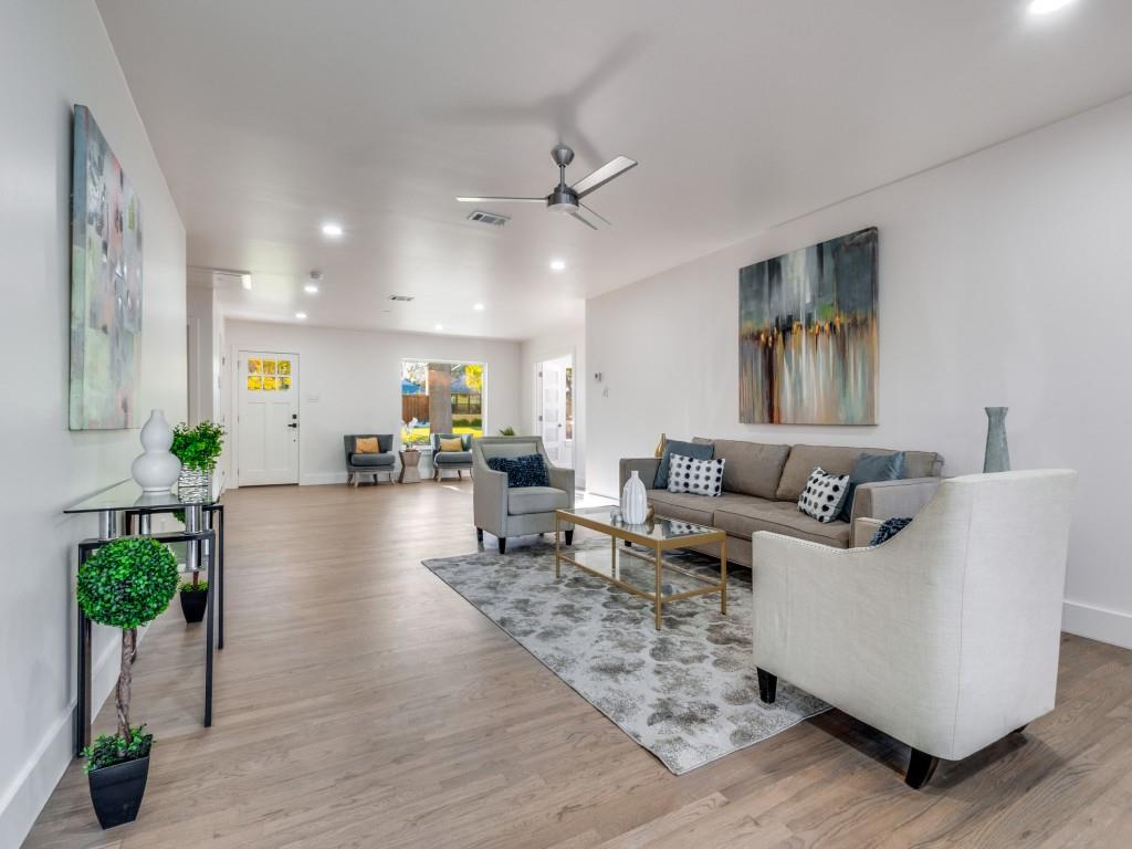 6611 Blessing Drive Dallas, TX 75214 - Photo 6 of 25 a living room with furniture and a chandelier