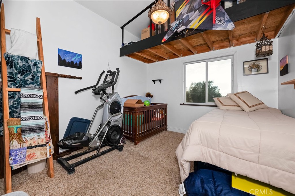 2728 Pentz Road Oroville, CA 95965 - Photo 26 of 52 a bedroom with furniture and a gym equipment