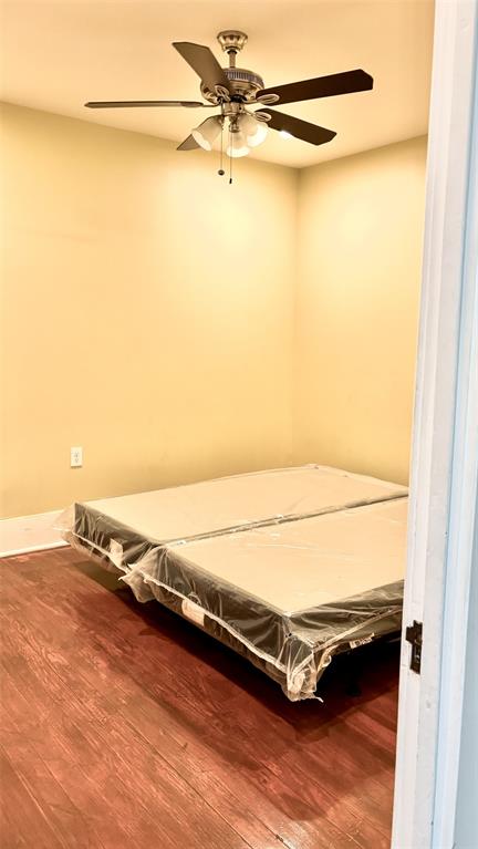 4616 Eastside Avenue, Unit A Dallas, TX 75226 - Photo 13 of 18 Bedroom 1 with wood finished floors and a ceiling fan