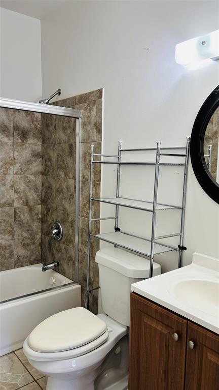 4616 Eastside Avenue, Unit A Dallas, TX 75226 - Photo 15 of 18 Bathroom featuring bathing tub / shower combination, vanity, and tile patterned flooring