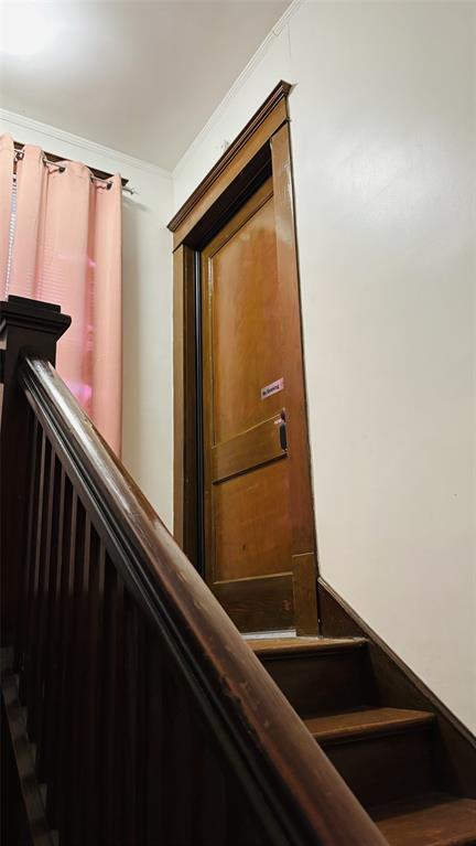 4616 Eastside Avenue, Unit A Dallas, TX 75226 - Photo 18 of 18 Stairway to apartment door with ornamental molding