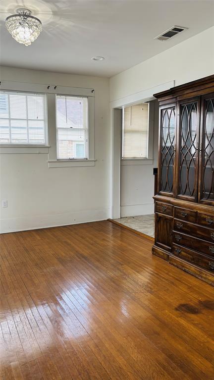 4616 Eastside Avenue, Unit A Dallas, TX 75226 - Photo 4 of 18 Dining room featuring wood-type flooring and baseboards