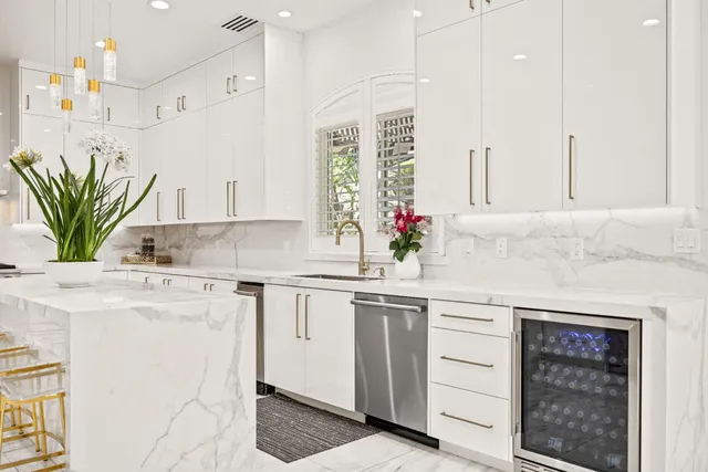 a spacious bedroom with a large bed and a large window