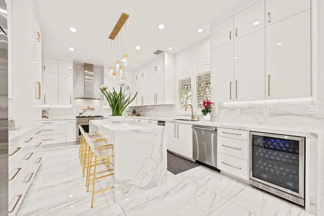 a spacious bedroom with a bed and a flat screen tv