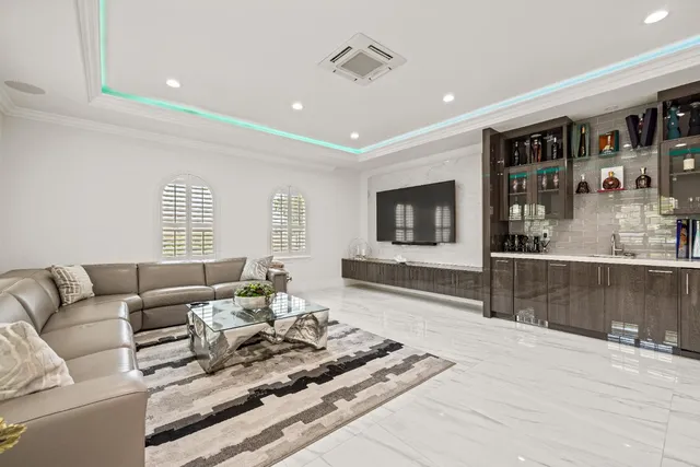 a view of a patio with table and chairs and potted plants