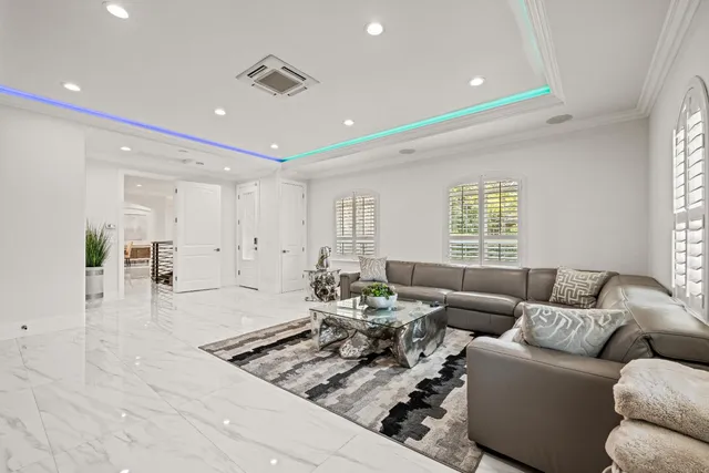 a patio with yard glass top table and chairs