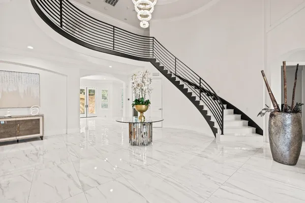a large kitchen with a table and chairs