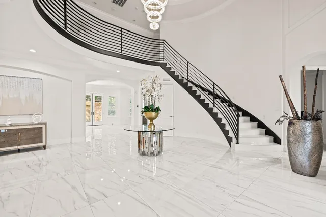 a large kitchen with a table and chairs