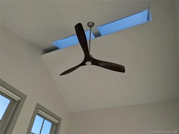 a bathroom with a tub a toilet and a shower