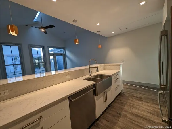 a spacious bathroom with a double vanity sink and a mirror