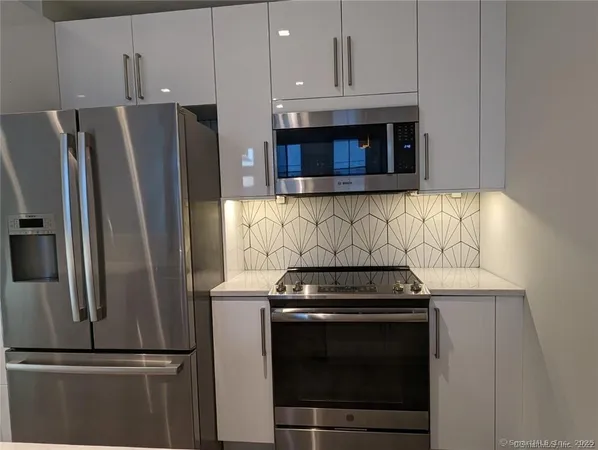 a close view of a stove top oven sitting inside of a kitchen