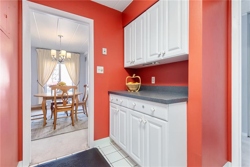 5 Bayard Road, Unit 308 Pittsburgh, PA 15213 - Photo 6 of 25 a kitchen with granite countertop white cabinets and white appliances
