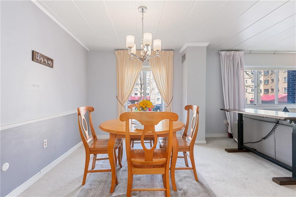 5 Bayard Road, Unit 308 Pittsburgh, PA 15213 - Photo 7 of 25 a view of a dining room with furniture and chandelier