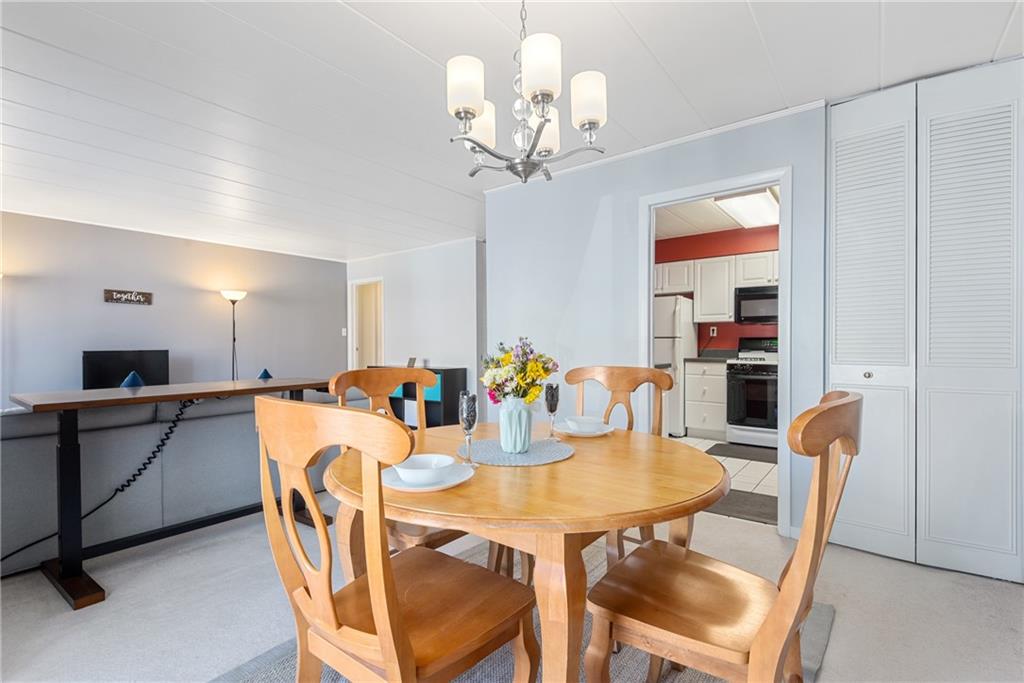 5 Bayard Road, Unit 308 Pittsburgh, PA 15213 - Photo 8 of 25 a view of a dining room with furniture and chandelier
