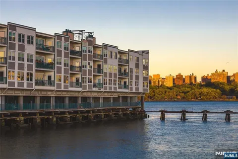 a view of a large building with a lake