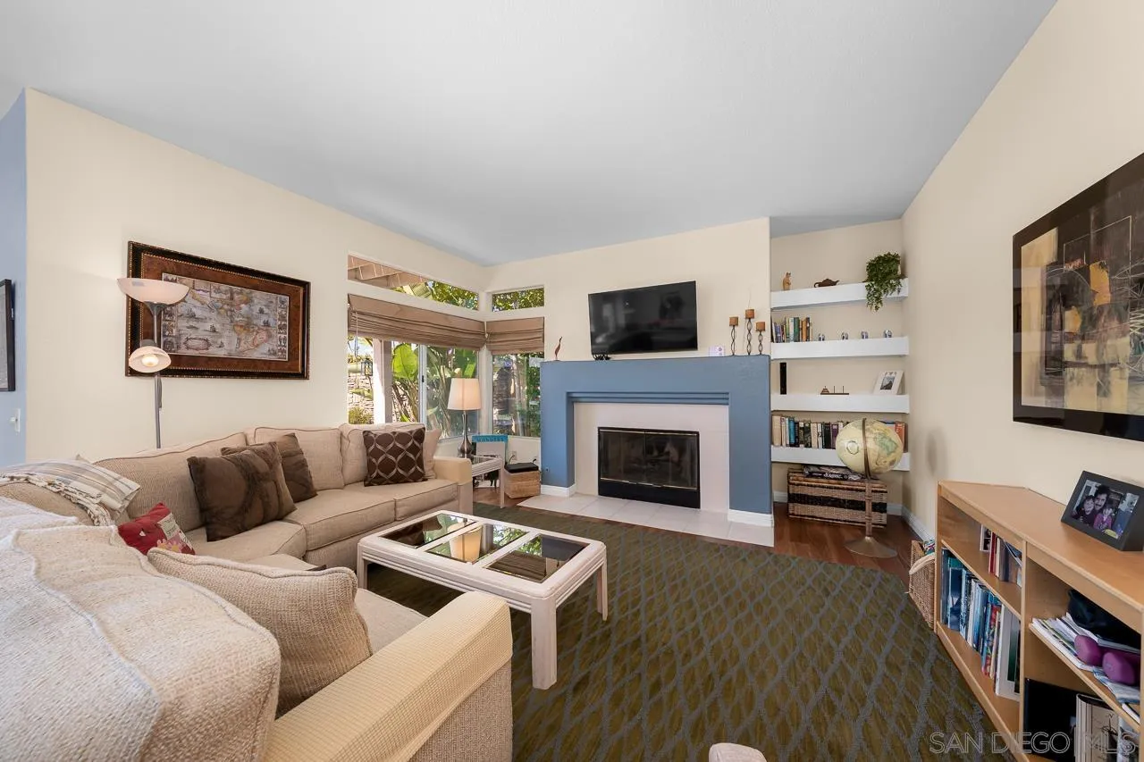 5114 Bella Collina Street Oceanside, CA 92056 - Photo 18 of 74 a living room with furniture and a fireplace
