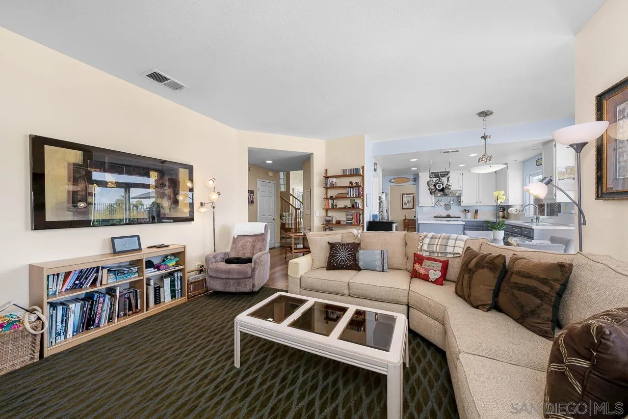 5114 Bella Collina Street Oceanside, CA 92056 - Photo 19 of 74 a living room with furniture and a flat screen tv