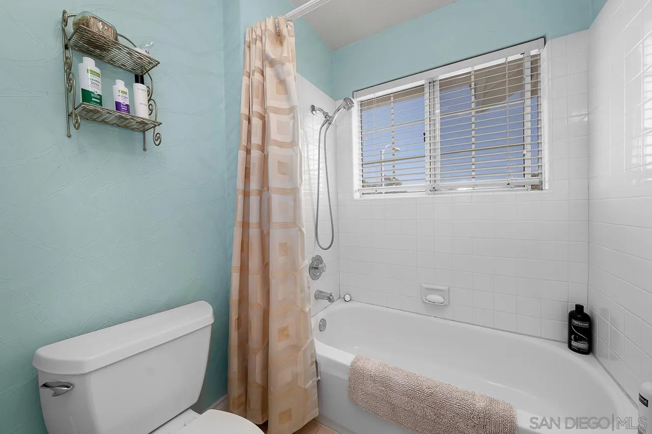 5114 Bella Collina Street Oceanside, CA 92056 - Photo 37 of 74 a bathroom with a toilet and a shower