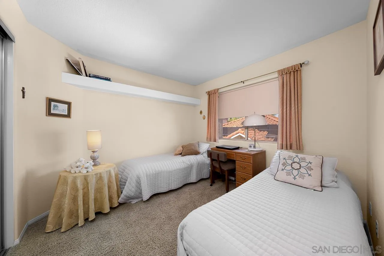5114 Bella Collina Street Oceanside, CA 92056 - Photo 40 of 74 a bedroom with two beds and painted walls