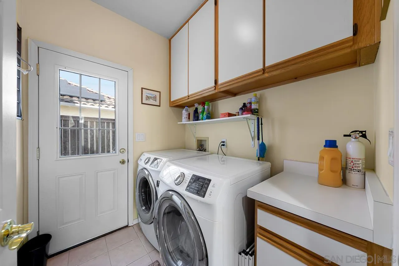 5114 Bella Collina Street Oceanside, CA 92056 - Photo 43 of 74 a utility room with dryer and washer