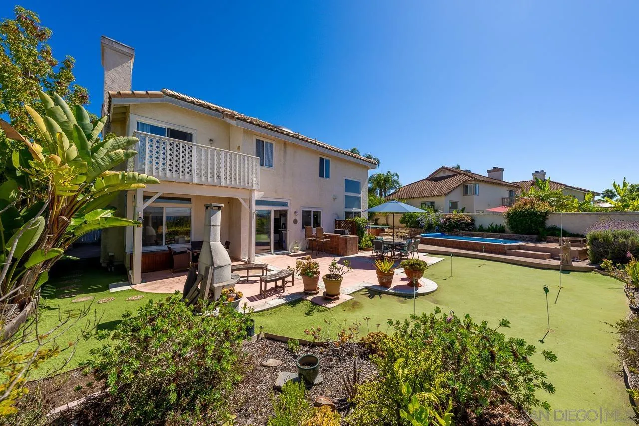 5114 Bella Collina Street Oceanside, CA 92056 - Photo 48 of 74 a view of a house with swimming pool and sitting area