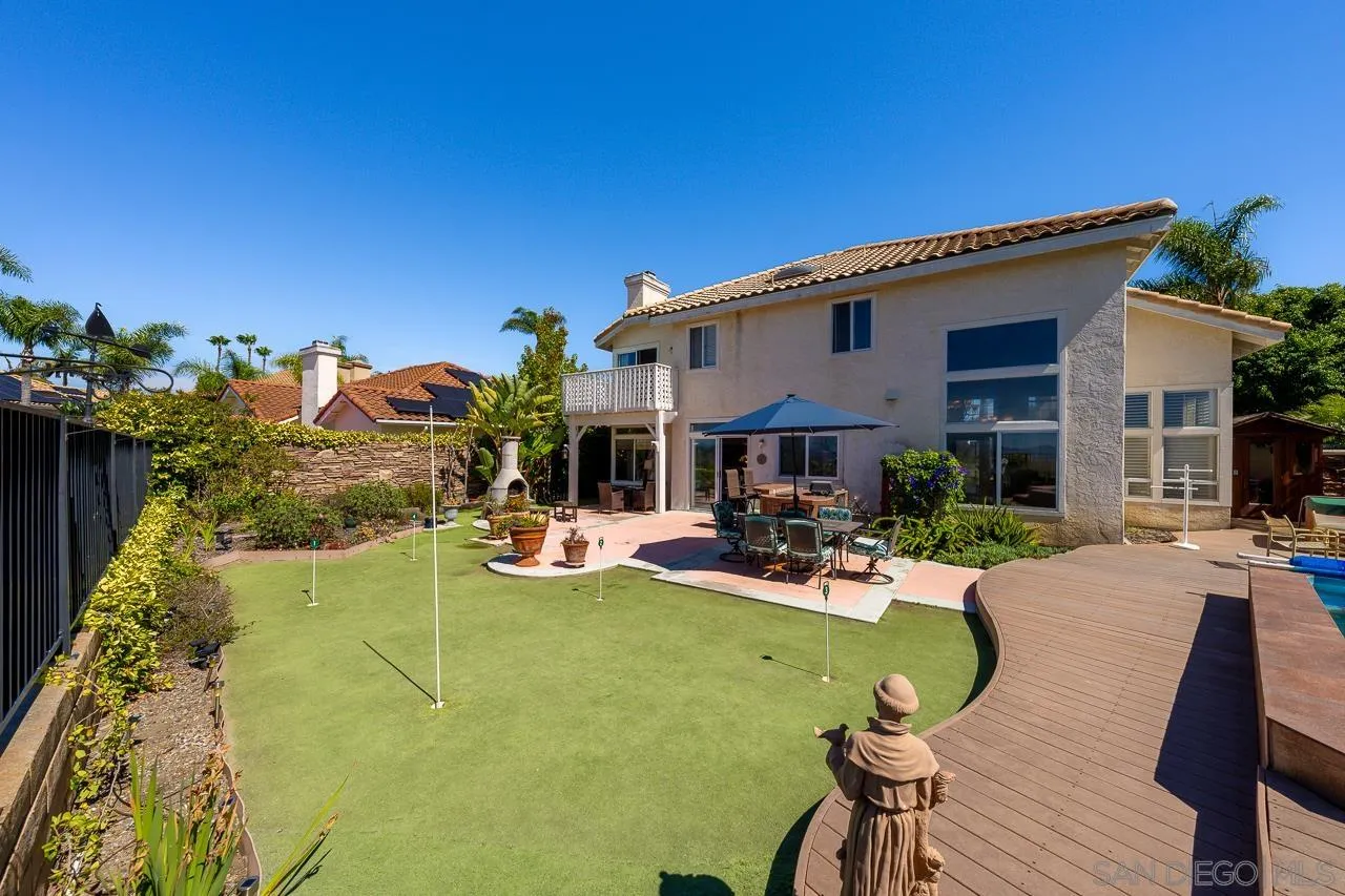 5114 Bella Collina Street Oceanside, CA 92056 - Photo 49 of 74 a view of a house with swimming pool and sitting area