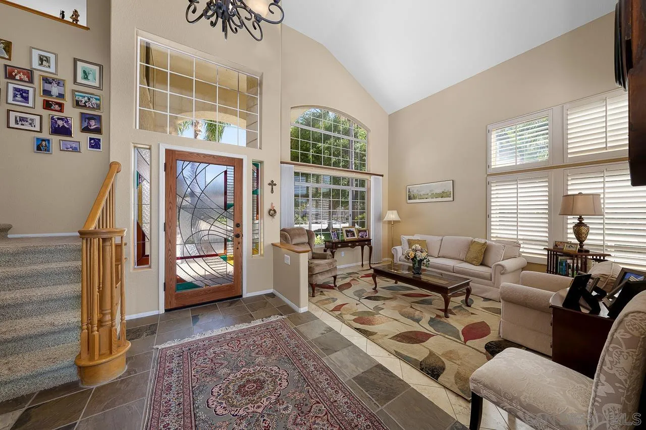 5114 Bella Collina Street Oceanside, CA 92056 - Photo 5 of 74 a living room with furniture and a large window