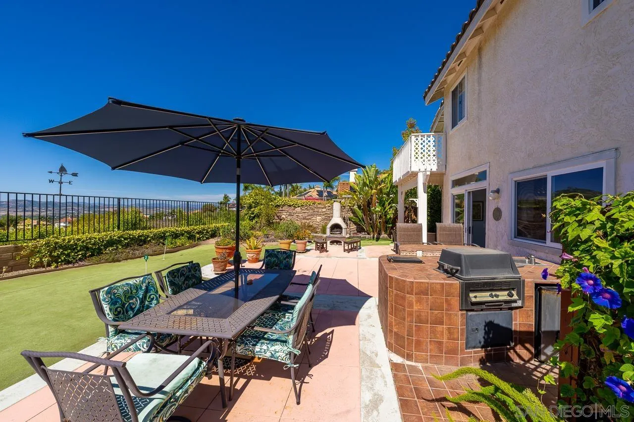5114 Bella Collina Street Oceanside, CA 92056 - Photo 53 of 74 a view of a patio with furniture and backyard