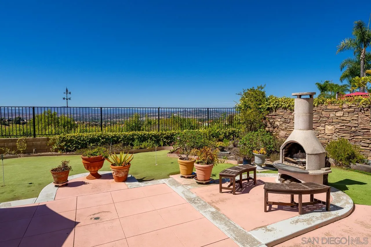 5114 Bella Collina Street Oceanside, CA 92056 - Photo 56 of 74 a view of a patio with chairs and plants