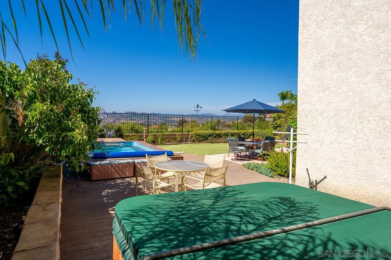 5114 Bella Collina Street Oceanside, CA 92056 - Photo 59 of 74 a view of a chairs and table on the wooden floor