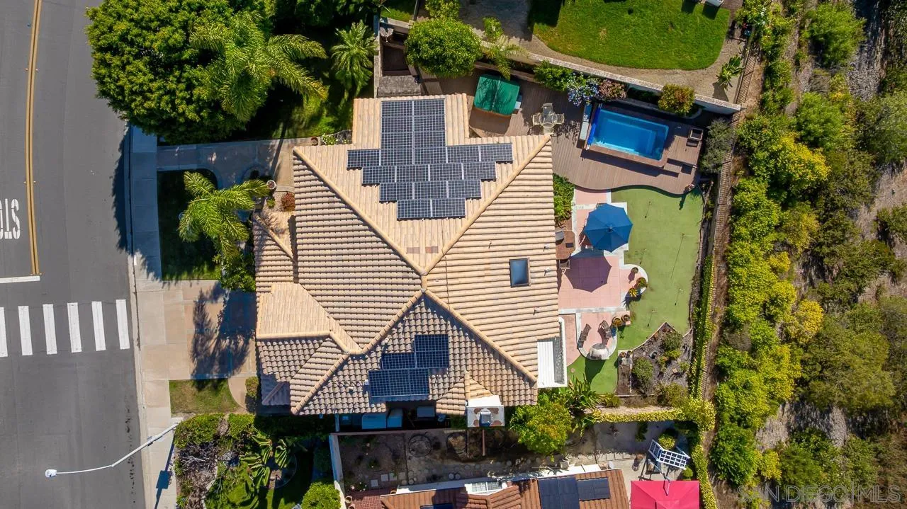 5114 Bella Collina Street Oceanside, CA 92056 - Photo 67 of 74 a aerial view of a house with swimming pool and wooden fence