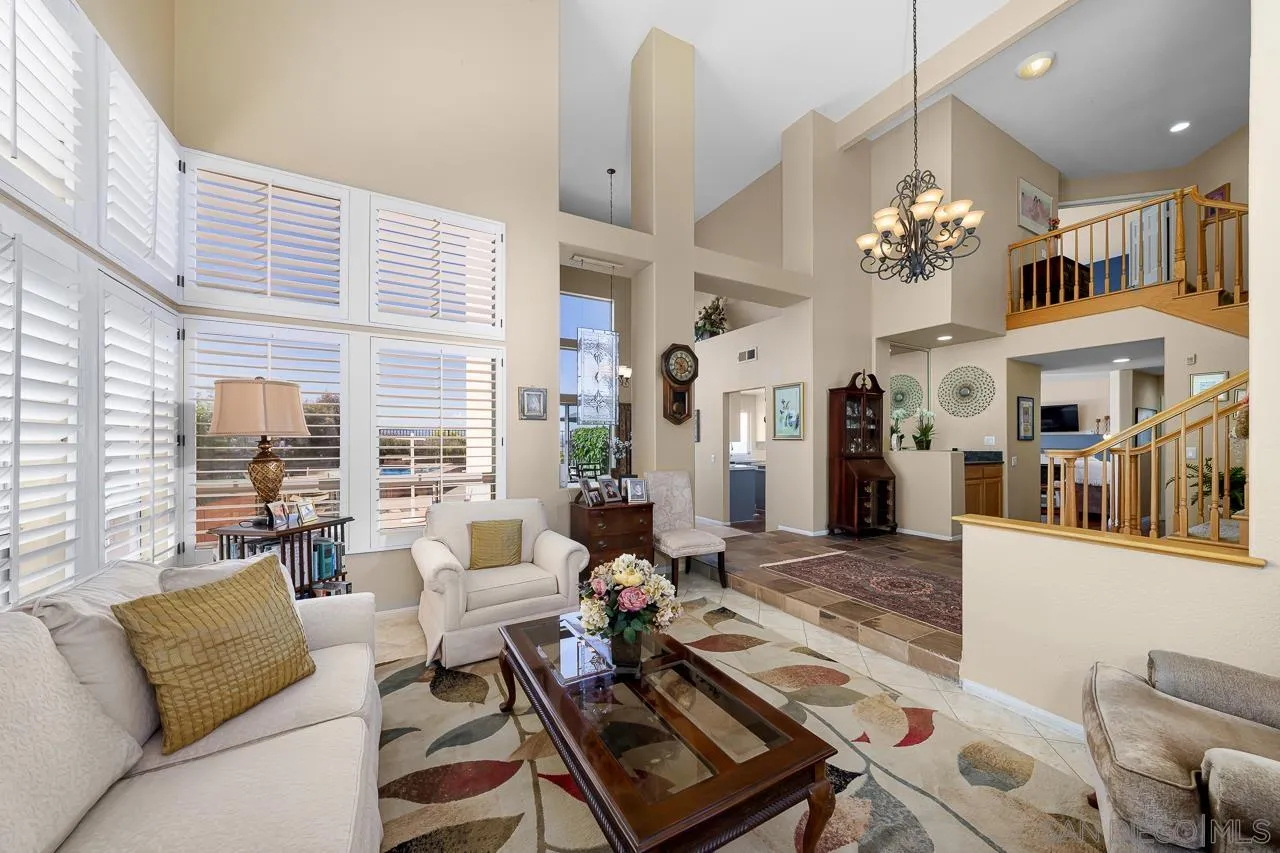 5114 Bella Collina Street Oceanside, CA 92056 - Photo 8 of 74 a living room with furniture fireplace and a large window
