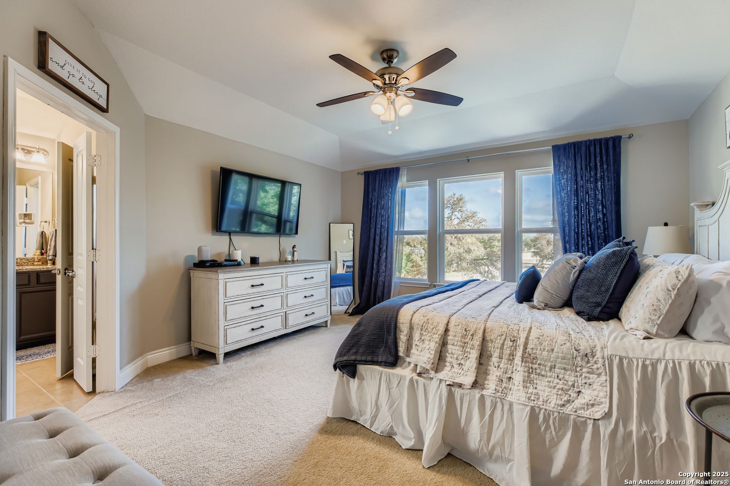 10639 Hibiscus Cove Helotes, TX 78023 - Photo 20 of 34 a bedroom with a bed and a large window