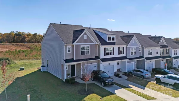a aerial view of a house with a yard
