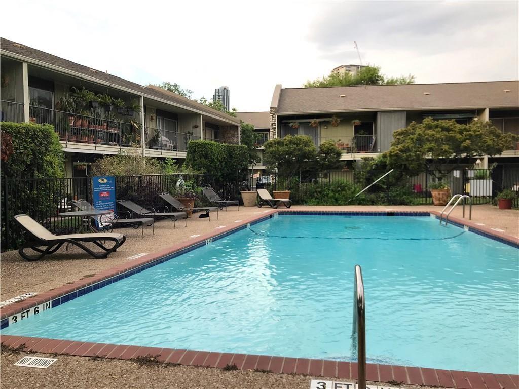 500 East Riverside Drive, Unit 154 Austin, TX 78704 - Photo 13 of 14 Outdoor swimming pool with brick coping, surrounded by a concrete deck