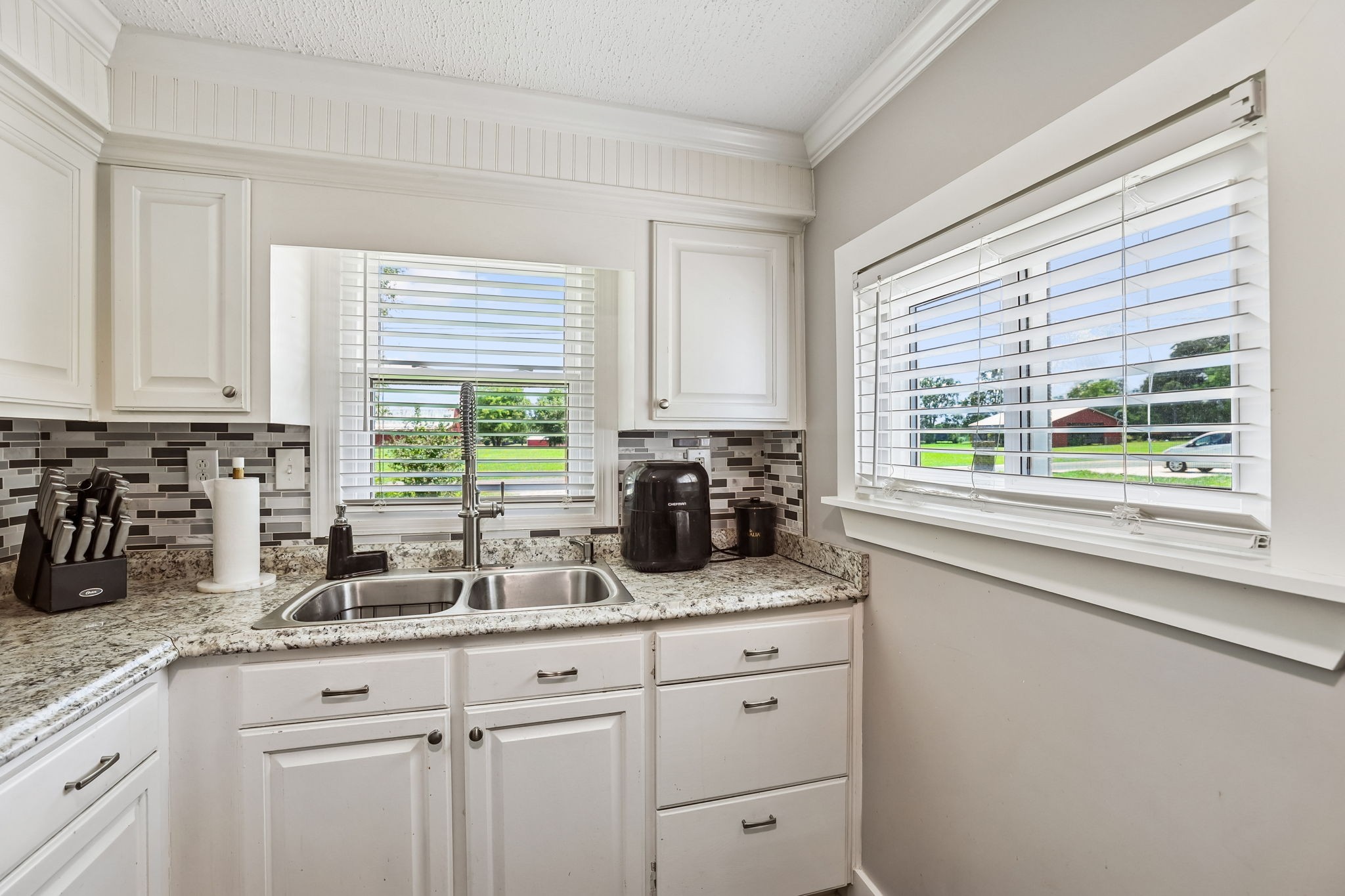 1466 Bible Crossing Road Winchester, TN 37398 - Photo 21 of 42 a kitchen with sink a window and cabinets