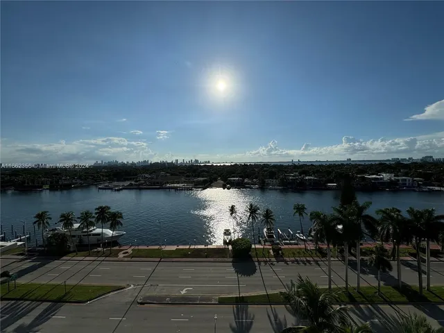 a view of a lake with sitting area
