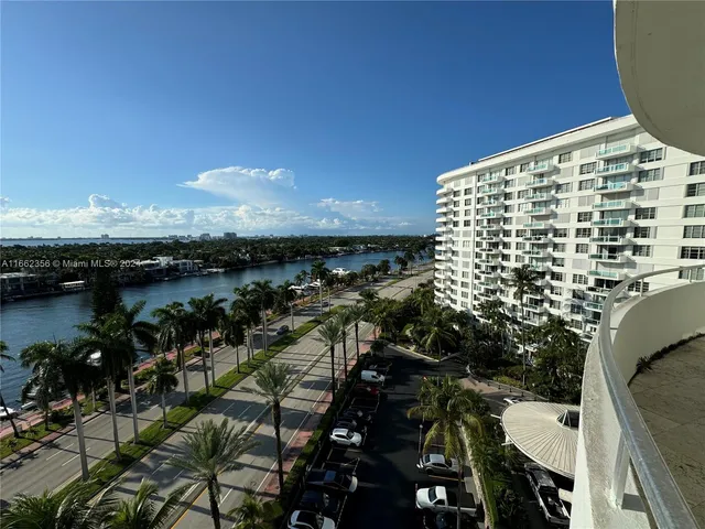 a bed room with two beds and a large window