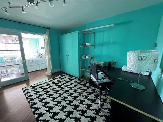 a room with lots of furniture and a large window