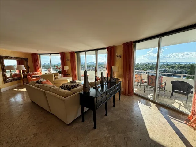 a view of a livingroom with furniture and window