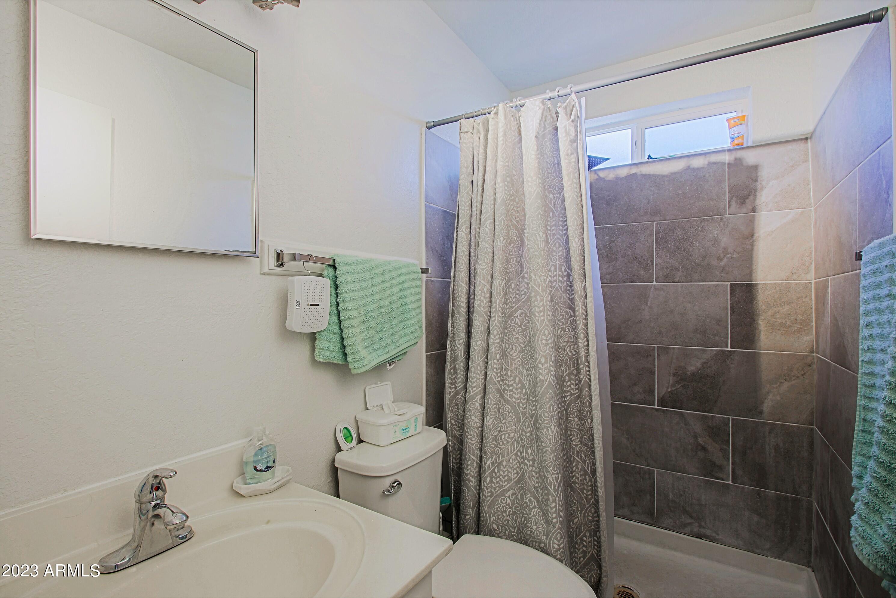 1734 West Fremont Rd. Phoenix, AZ 85041 - Photo 17 of 33 Tiled walk in shower