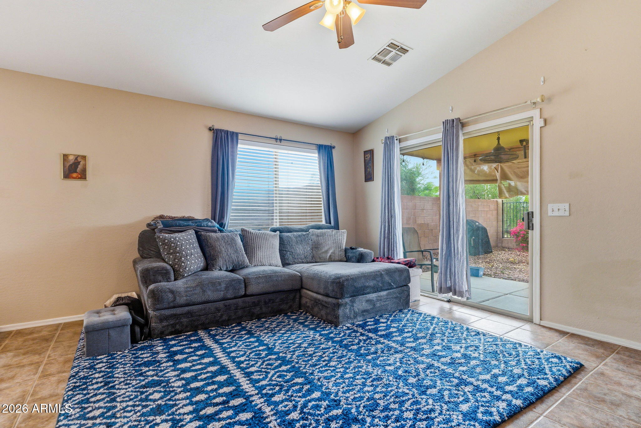 15843 West Washington Street Goodyear, AZ 85338 - Photo 16 of 39 a living room with furniture and a rug