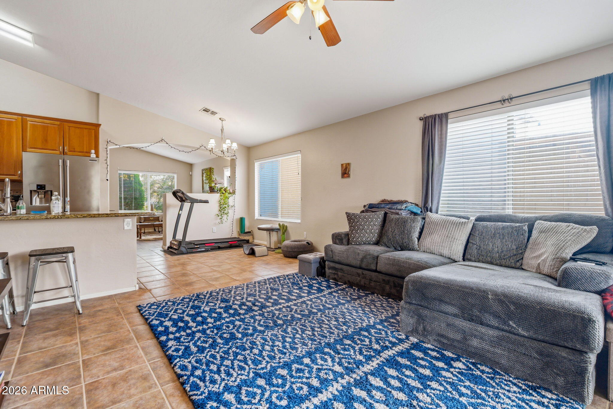 15843 West Washington Street Goodyear, AZ 85338 - Photo 19 of 39 a living room with furniture and a large window